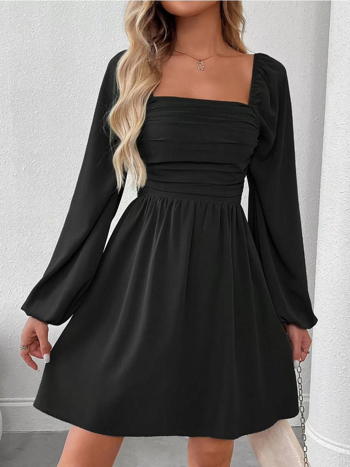 Black mini dress front view with square neckline