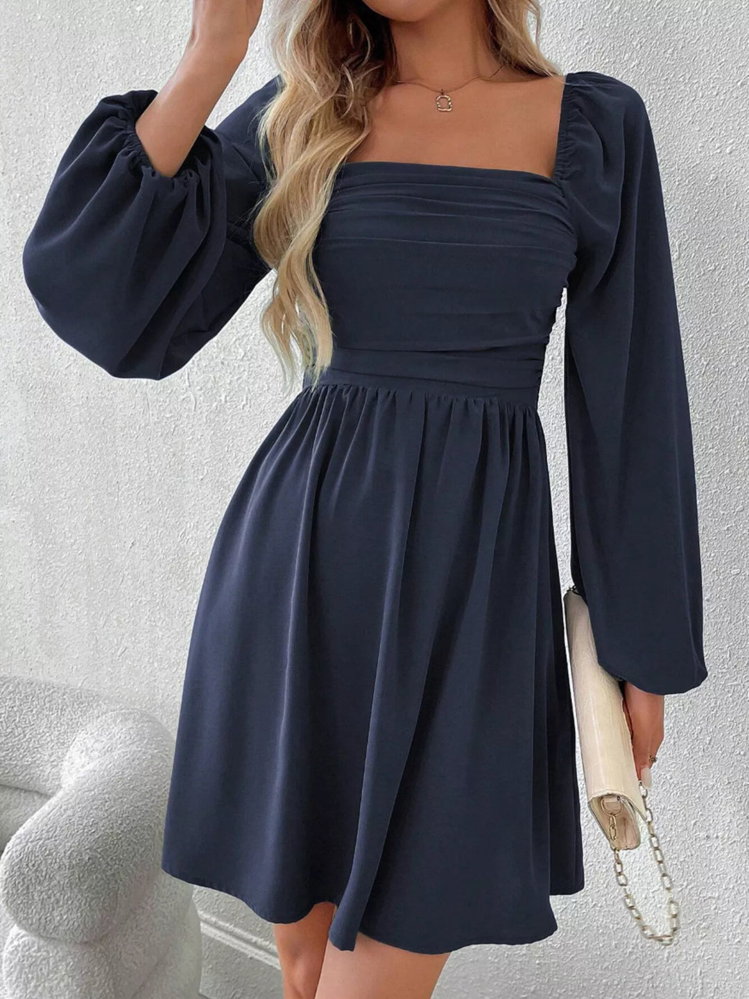Navy blue mini dress front view with square neckline