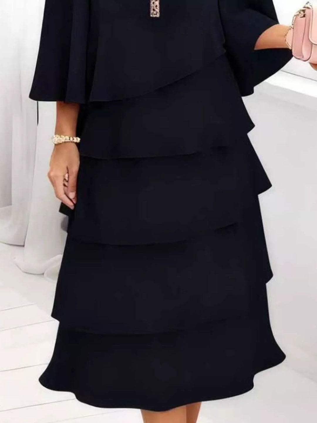 Tiered ruffle layered bell sleeve plus size in black, close-up detail