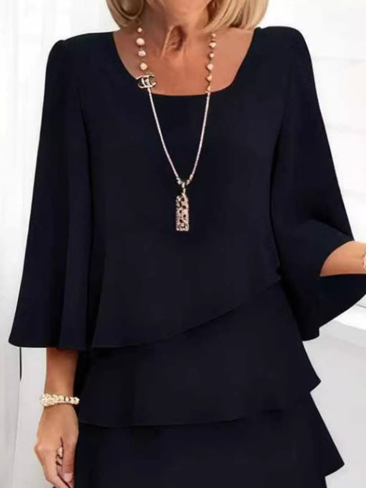 Tiered ruffle layered bell sleeve plus size in black, styled on model