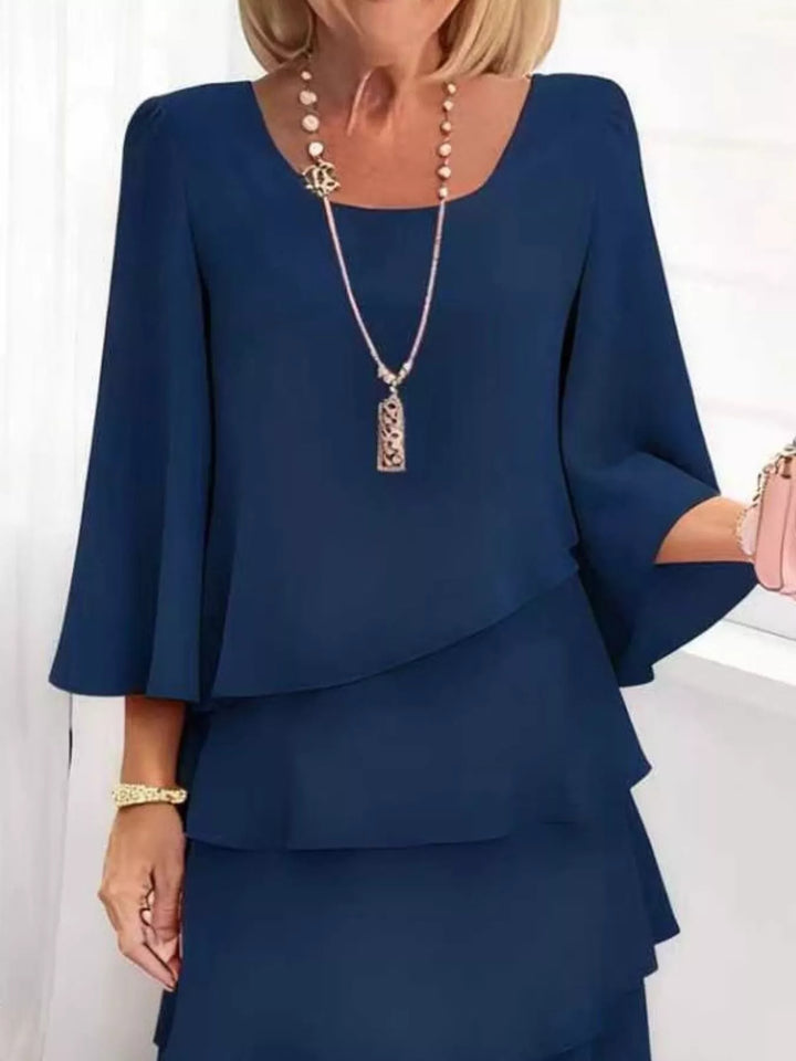 Tiered ruffle layered bell sleeve plus size in dark blue, styled on model