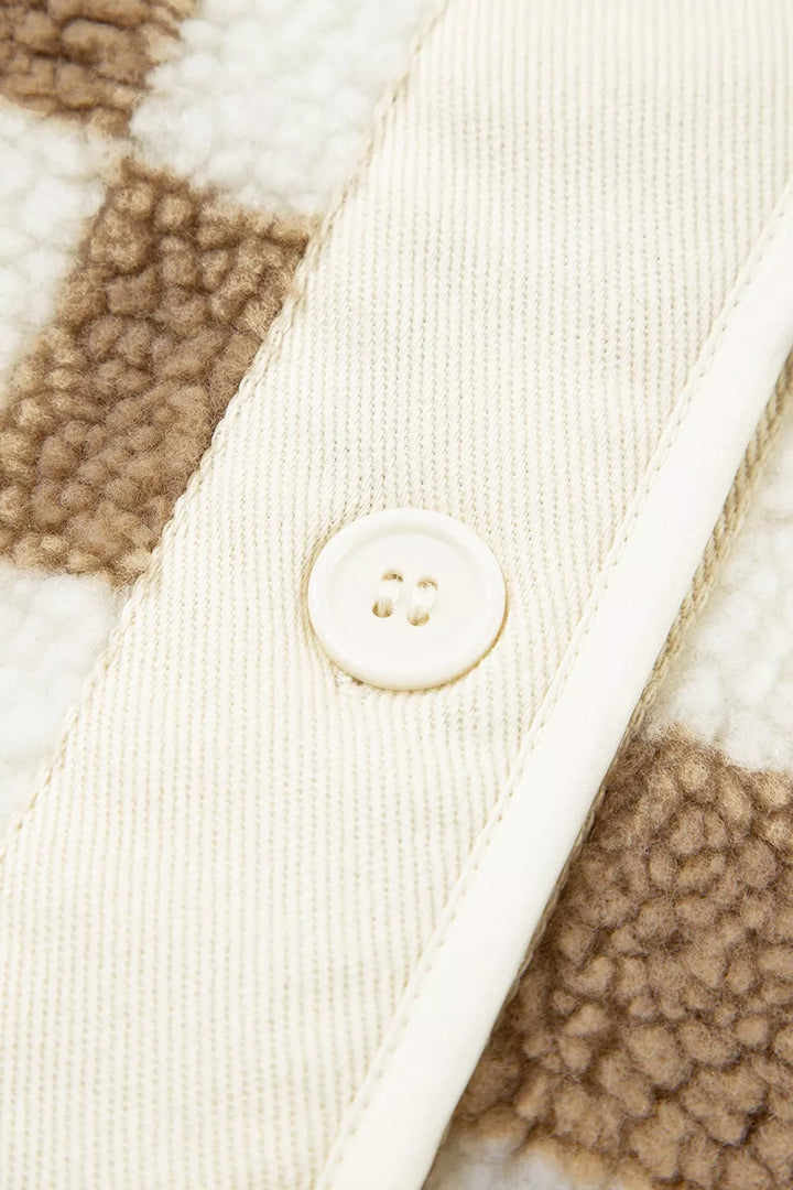 Close-up of the button placket and corduroy facing on the checkerboard jacket