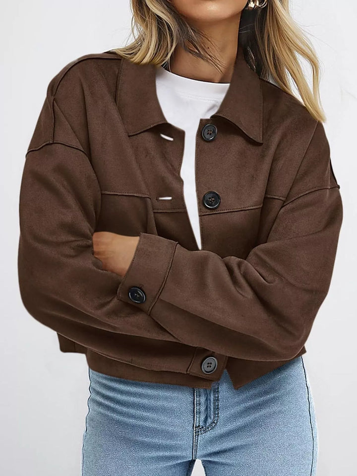 Coffee brown button front jacket with arms crossed, front view