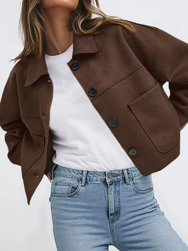 Coffee brown cropped fall jacket with chest pockets, hand on hip