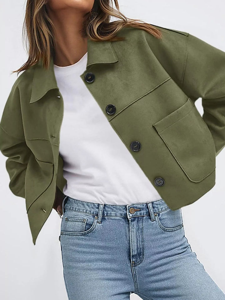 Olive cropped fall jacket with button front, hand on hip