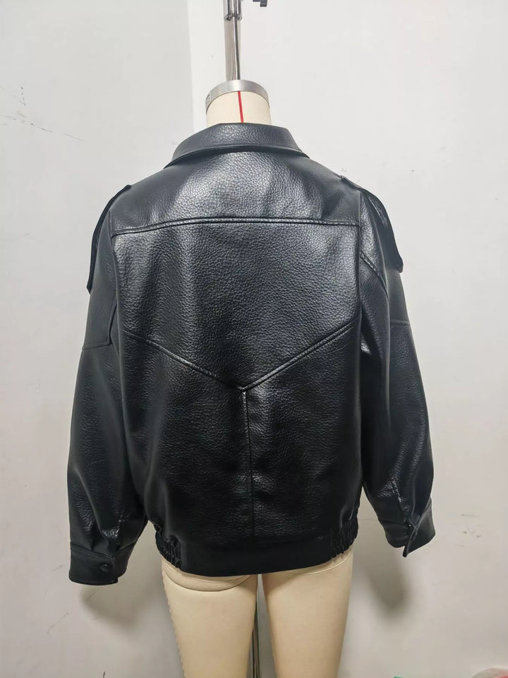 Back view of the black moto jacket showing the yoke seam