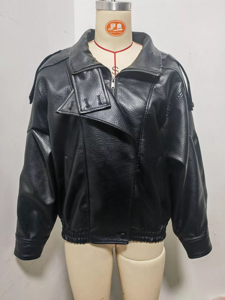 Black moto jacket on a mannequin, front view with asymmetric zip