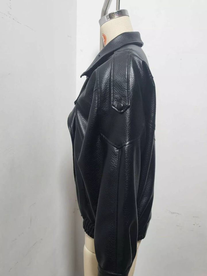 Side view of the black oversized moto jacket on a mannequin