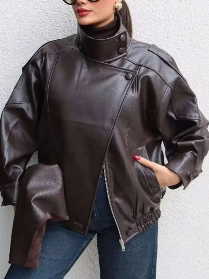 Chocolate brown oversized moto jacket with asymmetric zip, relaxed pose