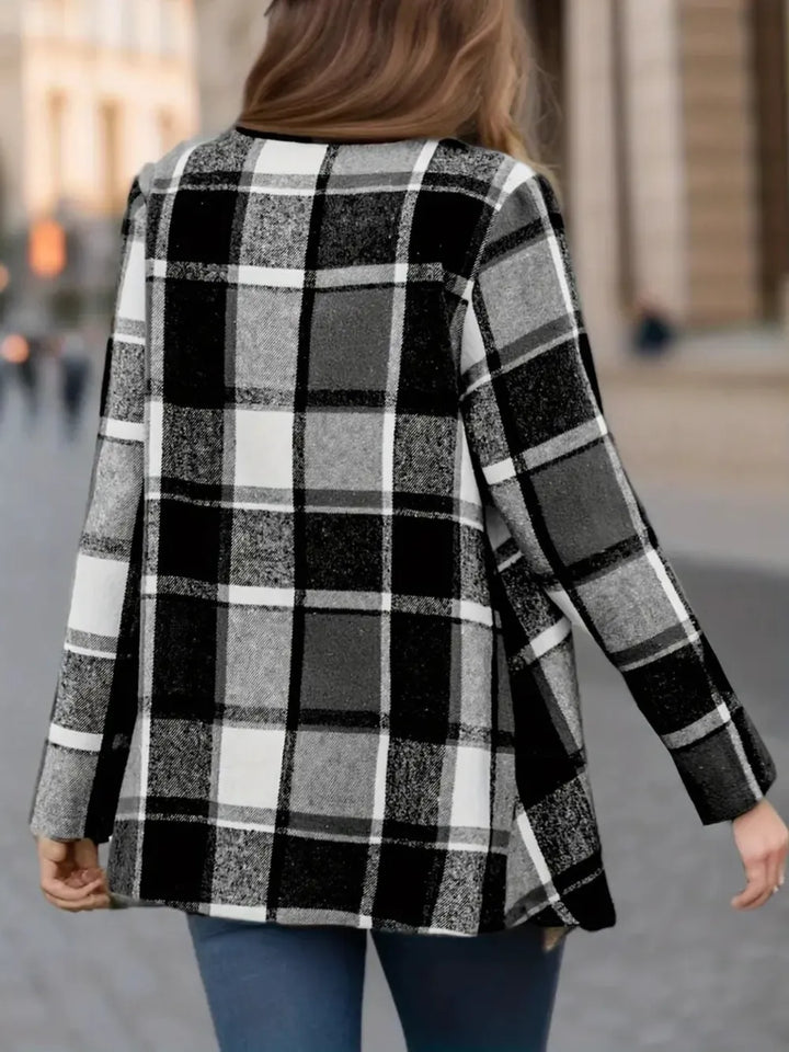 Back view of the black white plaid jacket with a loose relaxed drape
