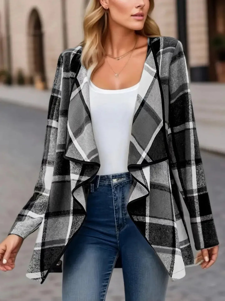 Plaid jacket in black and white layered over a white tank, street style look