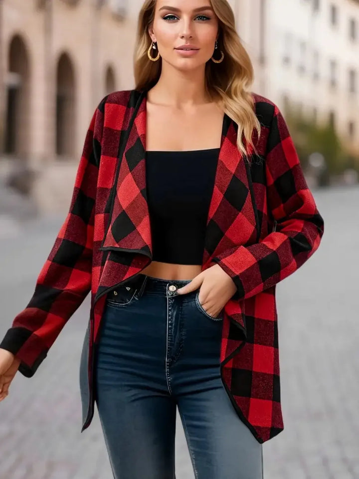 Red plaid waterfall jacket worn open with one hand in the jeans pocket