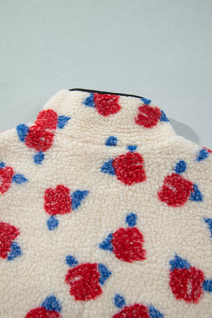 Close-up of the rose print plush texture and black piped collar