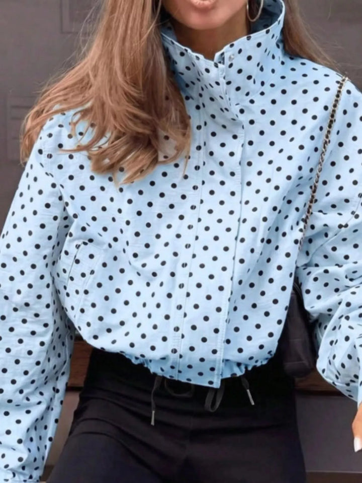 Polka dot zip front stand collar cropped in blue, front view