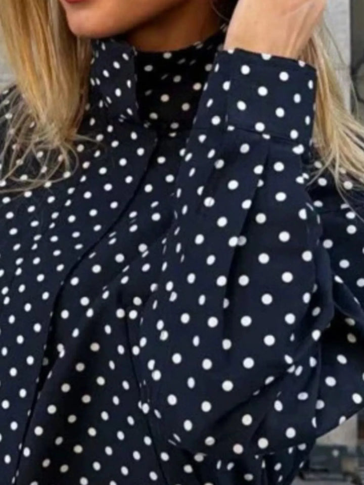 Polka dot zip front stand collar cropped in navy blue, close-up detail