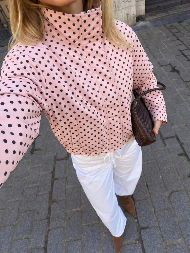 Polka dot zip front stand collar cropped in pink, styled on model