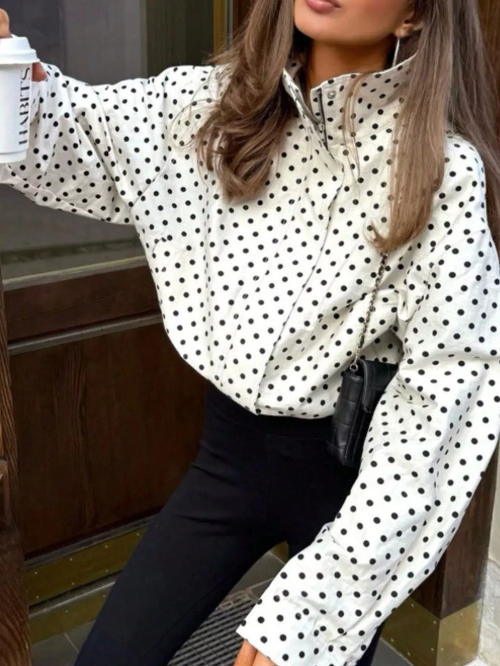 Polka dot zip front stand collar cropped in white, styled on model