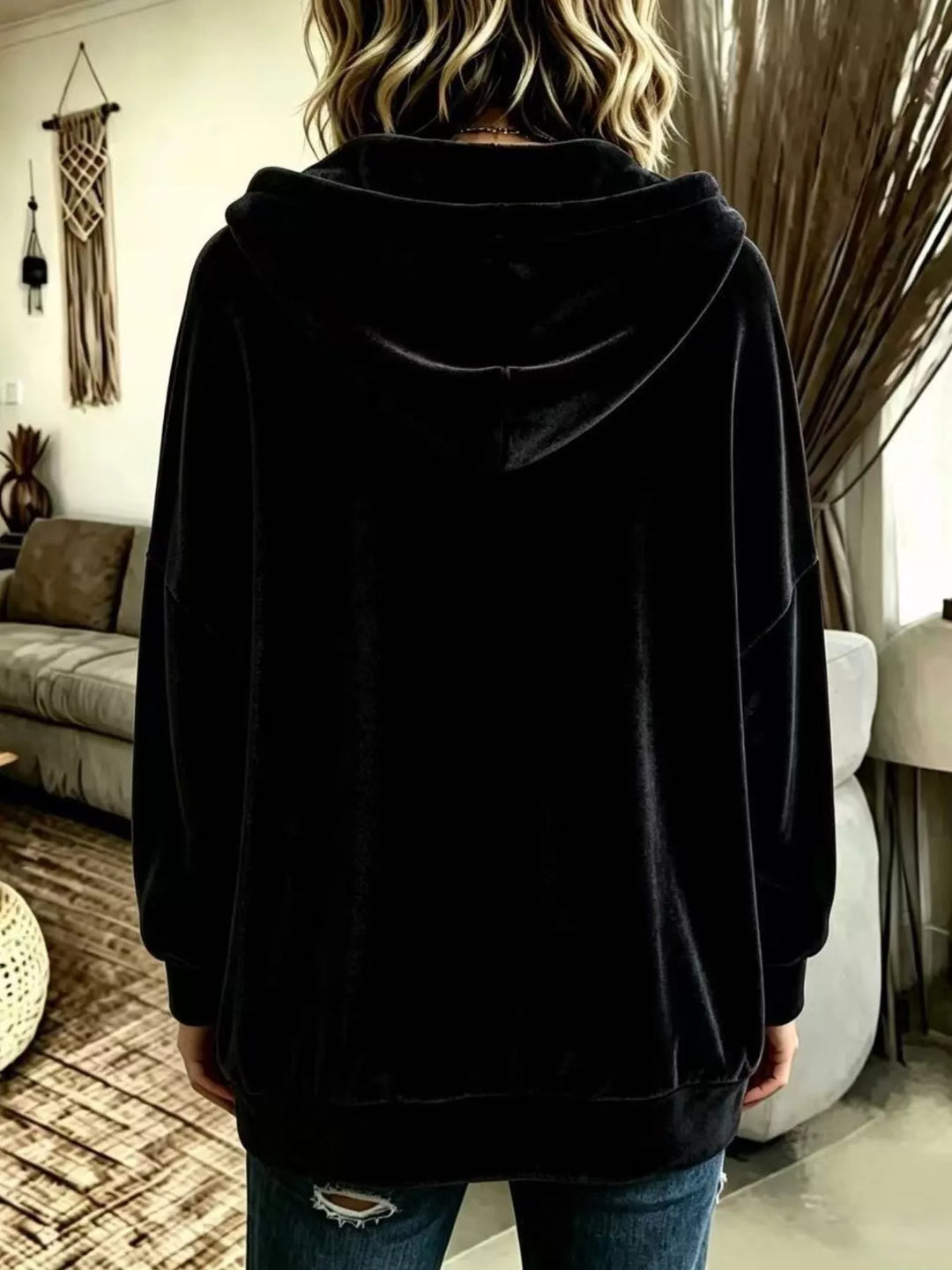 Back view of the black velvet-look hooded jacket