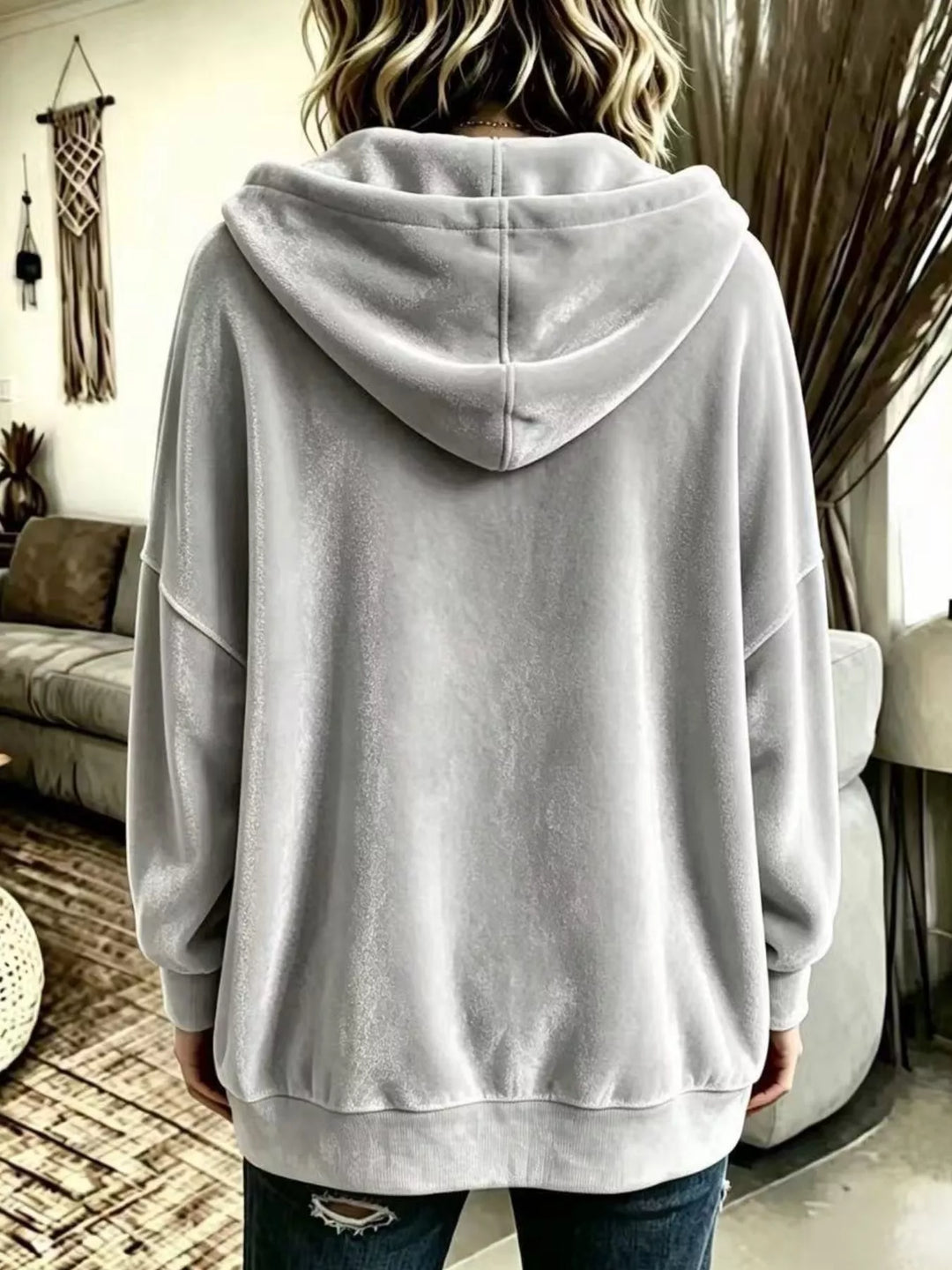 Back view of the light gray relaxed hooded jacket