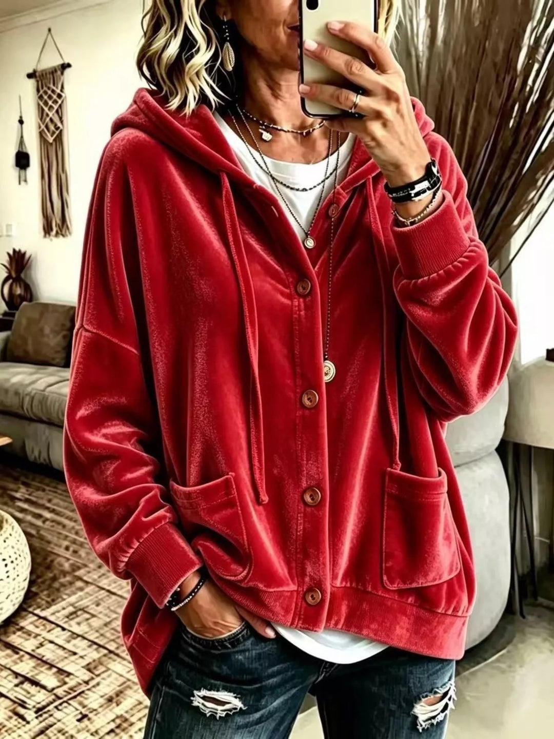 Red velvet-look hooded button front jacket styled with a white tee and jeans