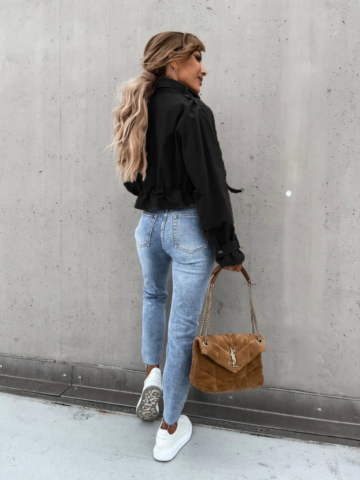 Snap front cropped flap pockets in black, back view