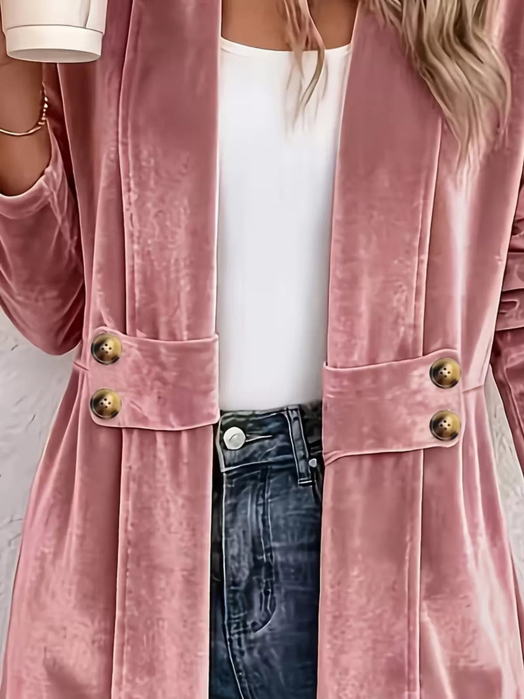 Close-up of the dusty rose jacket waist panel with two gold buttons