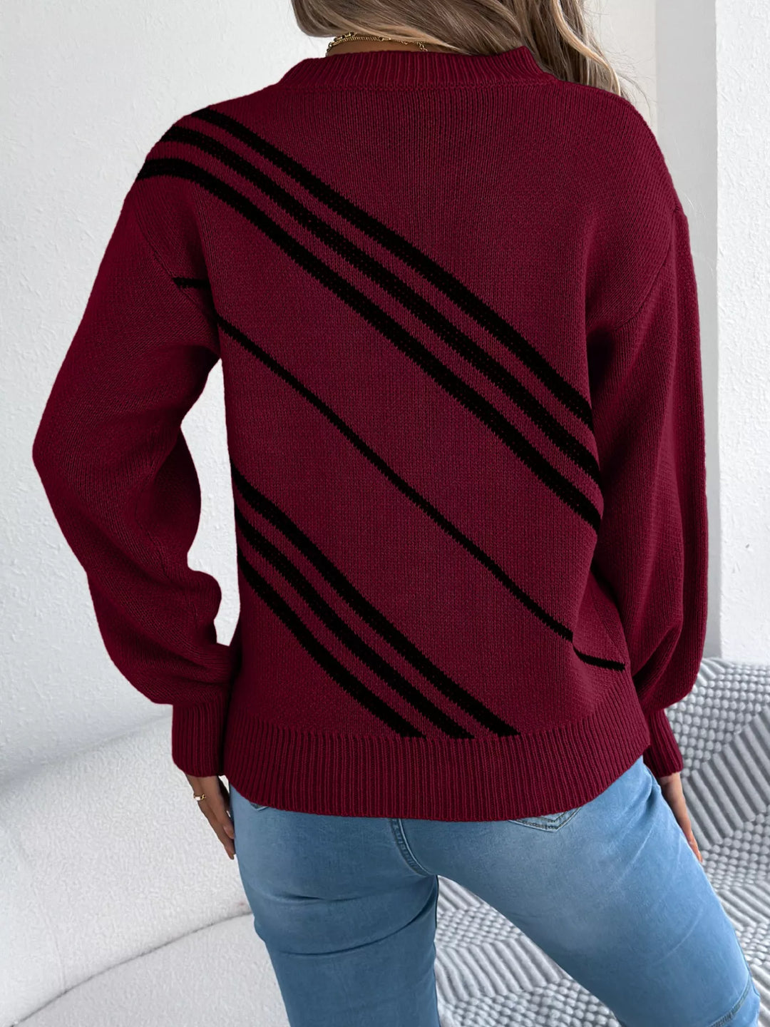 Back view of the burgundy crew neck sweater with diagonal stripes