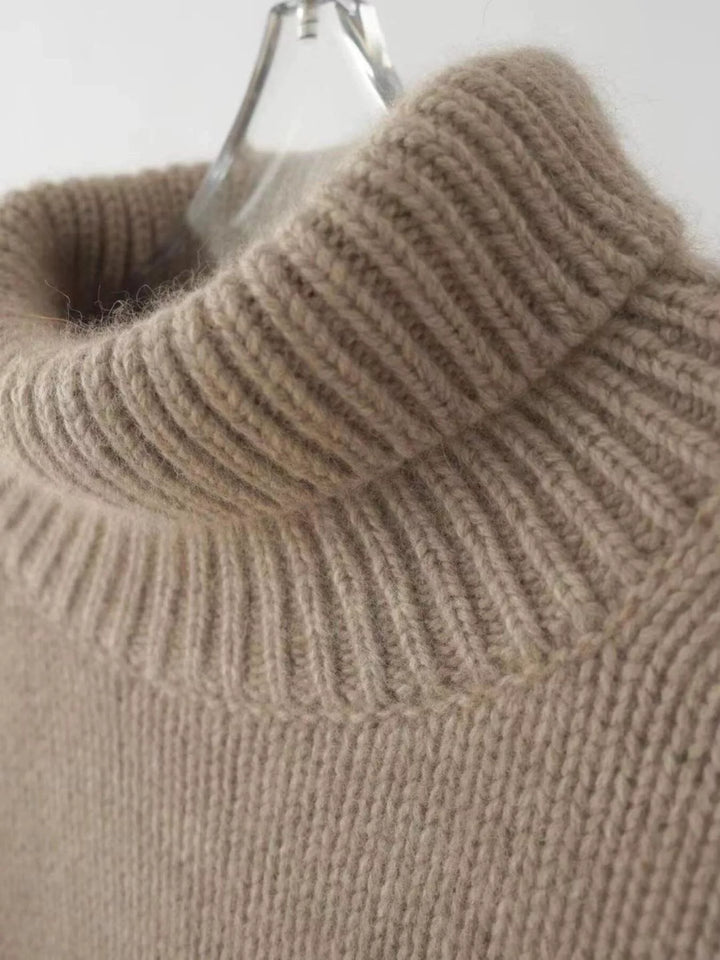 Close-up of the mocha ribbed turtleneck collar on a hanger