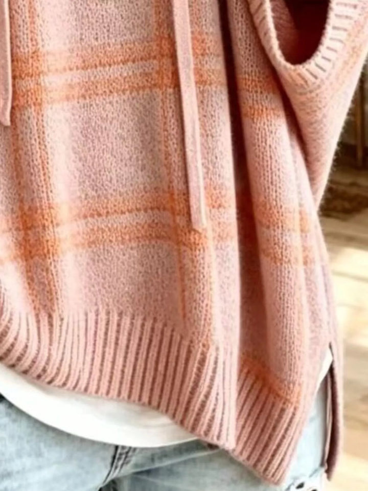 Close-up of the blush pink plaid knit with ribbed hem