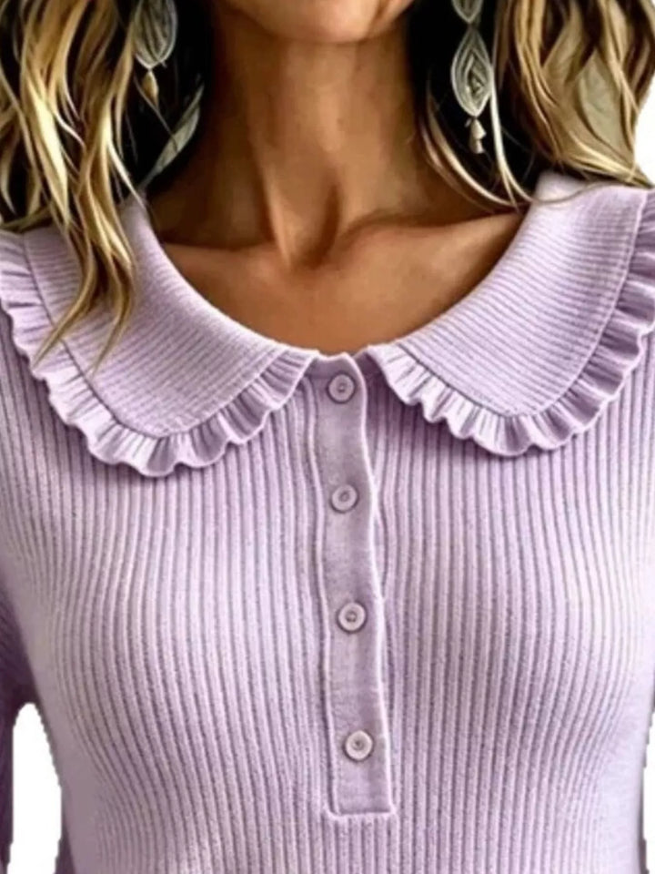 Close-up of lavender sweater ruffle Peter Pan collar and buttons