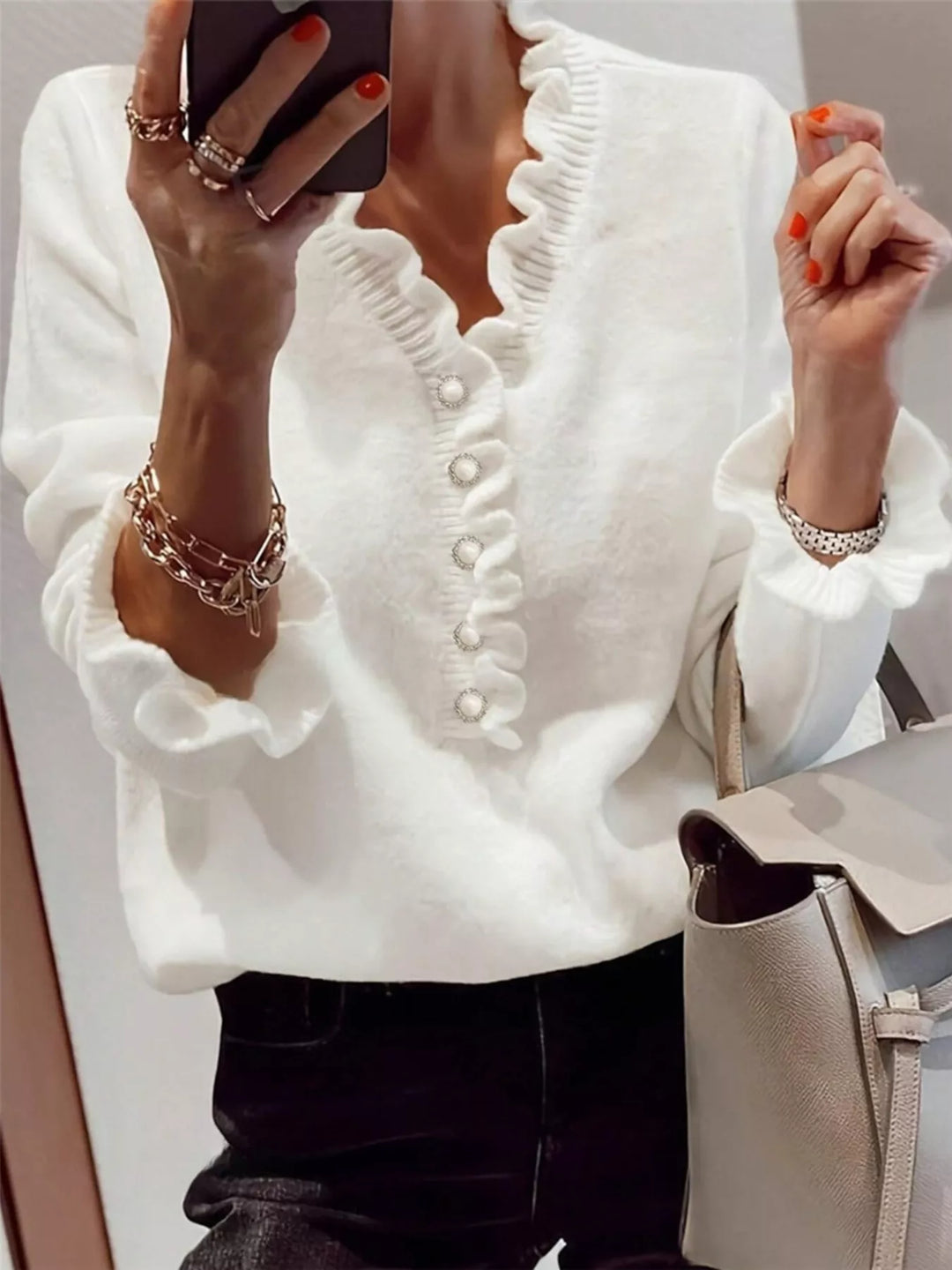 White fall sweater with ruffled V neck and pearl look button front