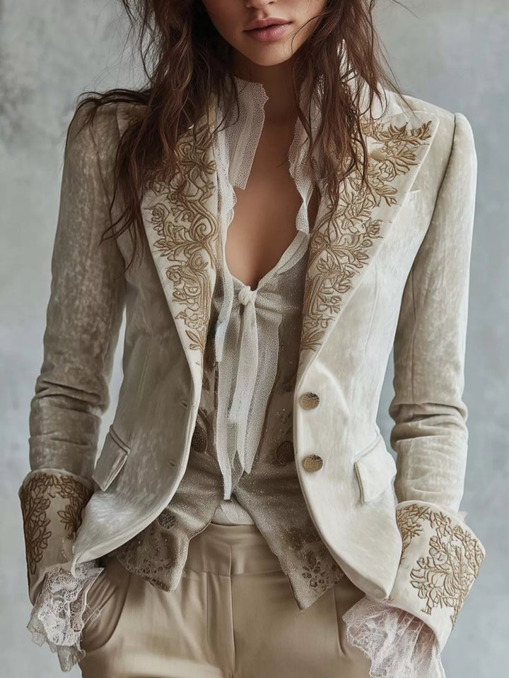 Women's fitted blazer in cream with embroidered lapels and lace cuff trim, front view