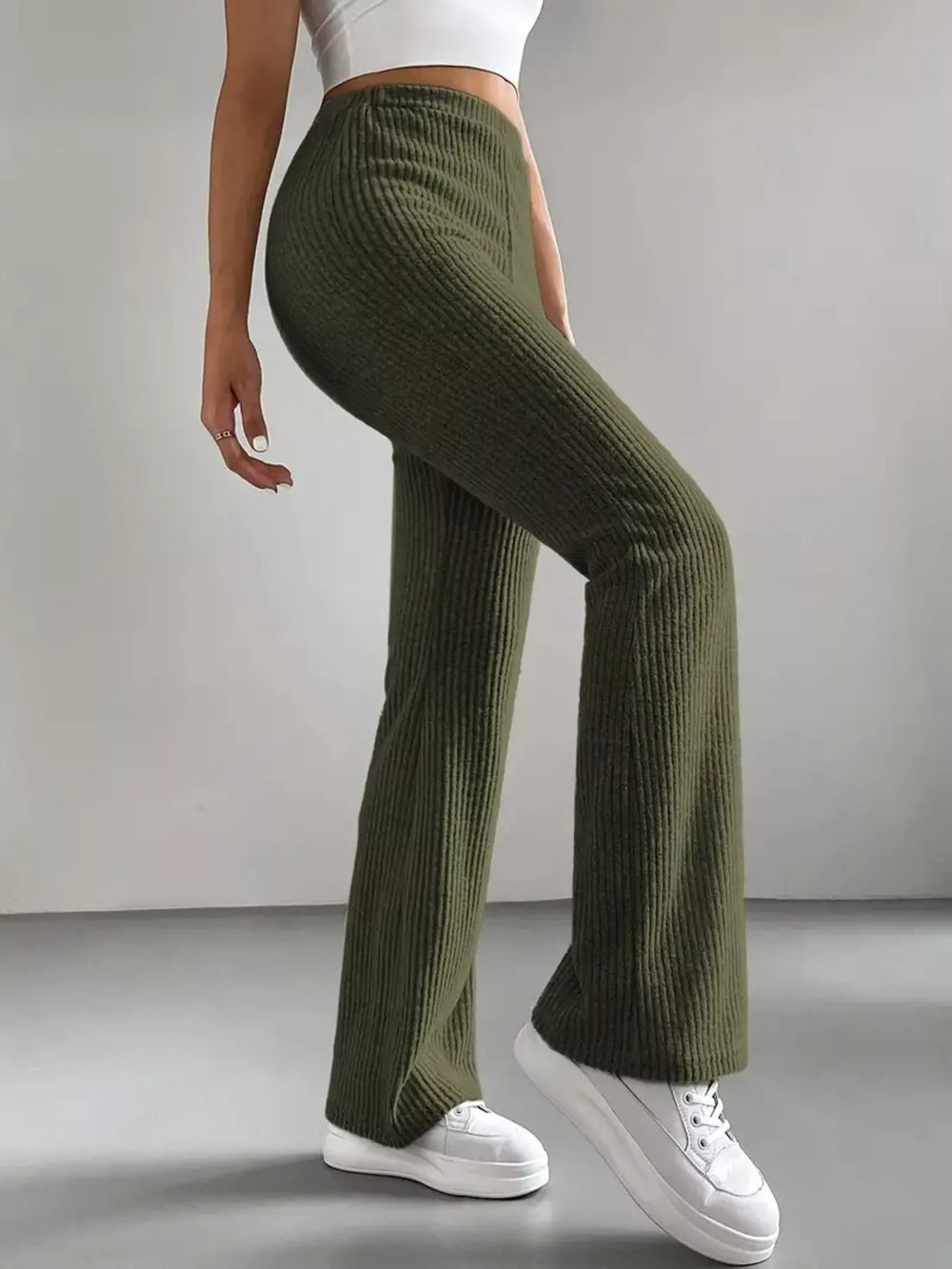 Olive green flare pants side view showing the high waist and flared leg