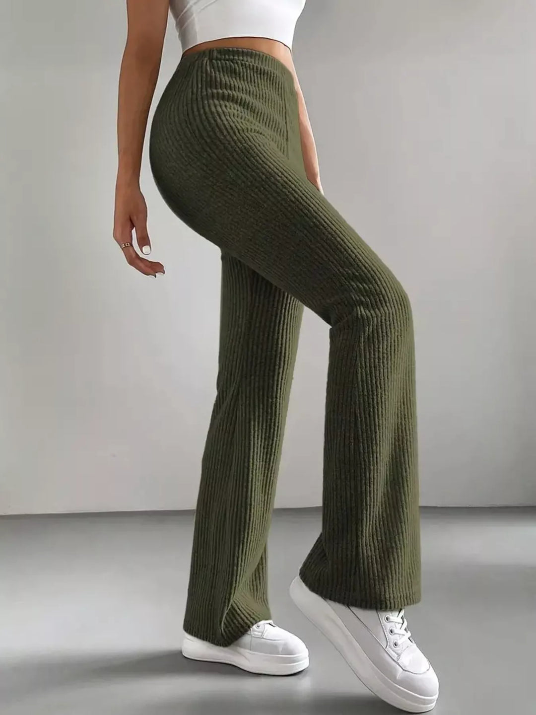Olive green flare pants side view showing the high waist and flared leg