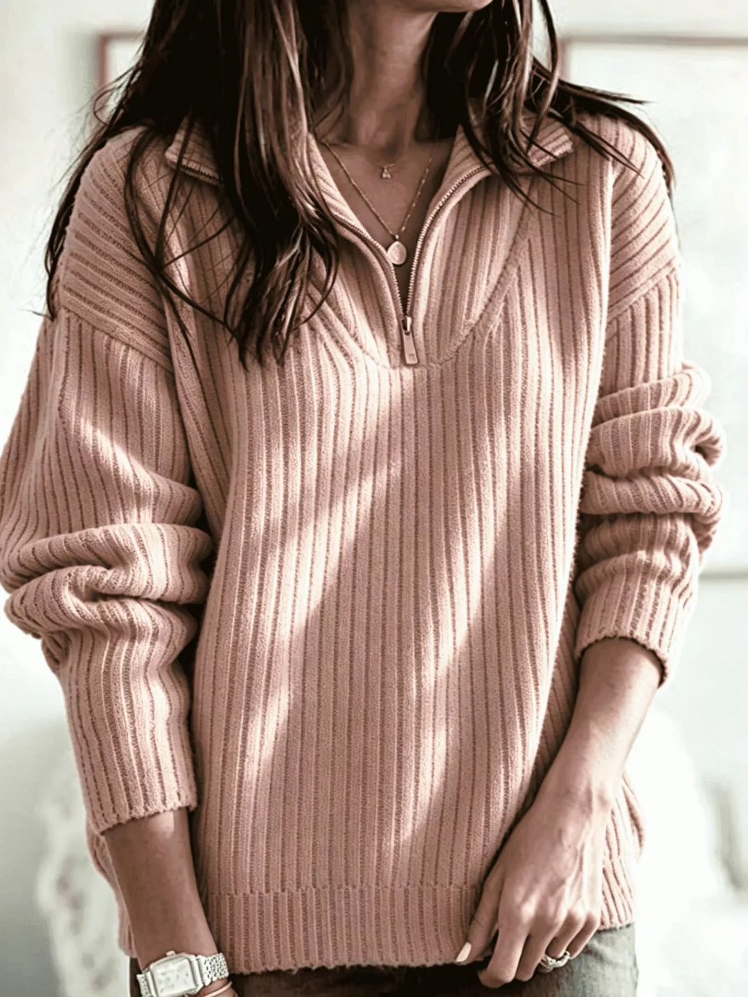 Dusty pink half zip sweater with ribbed knit collar and relaxed fit