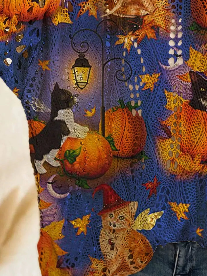 Close-up of the blue print with a black cat, lantern and pumpkins