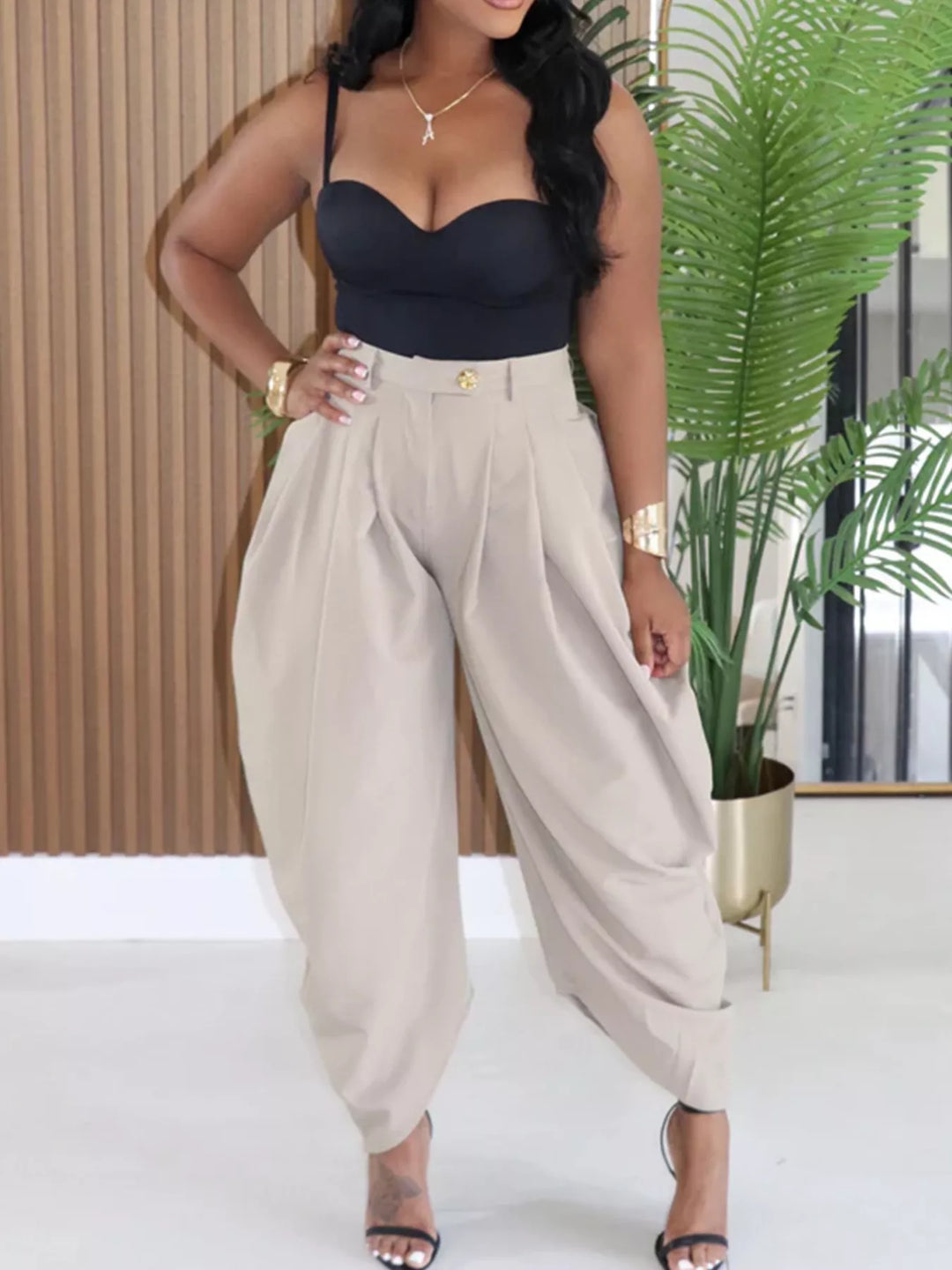 Stone colored high waisted harem pants with pleats, styled with a black bustier