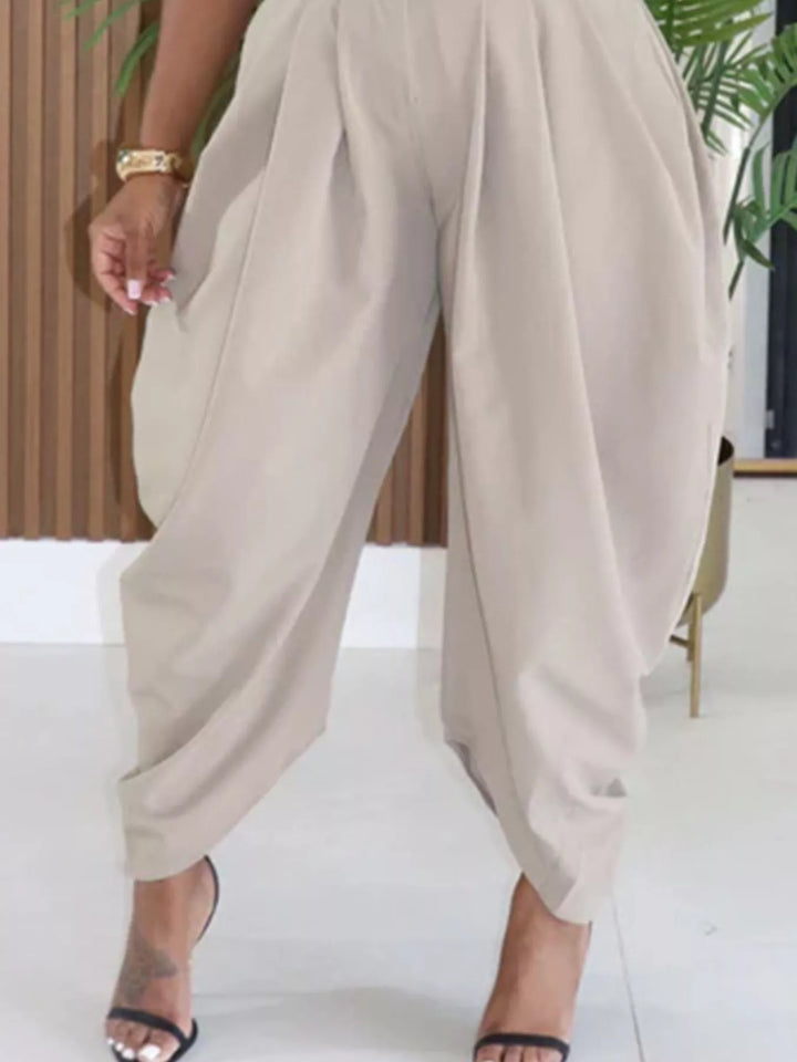 Stone pleated harem pants side view with the wrapped hem and strappy sandals