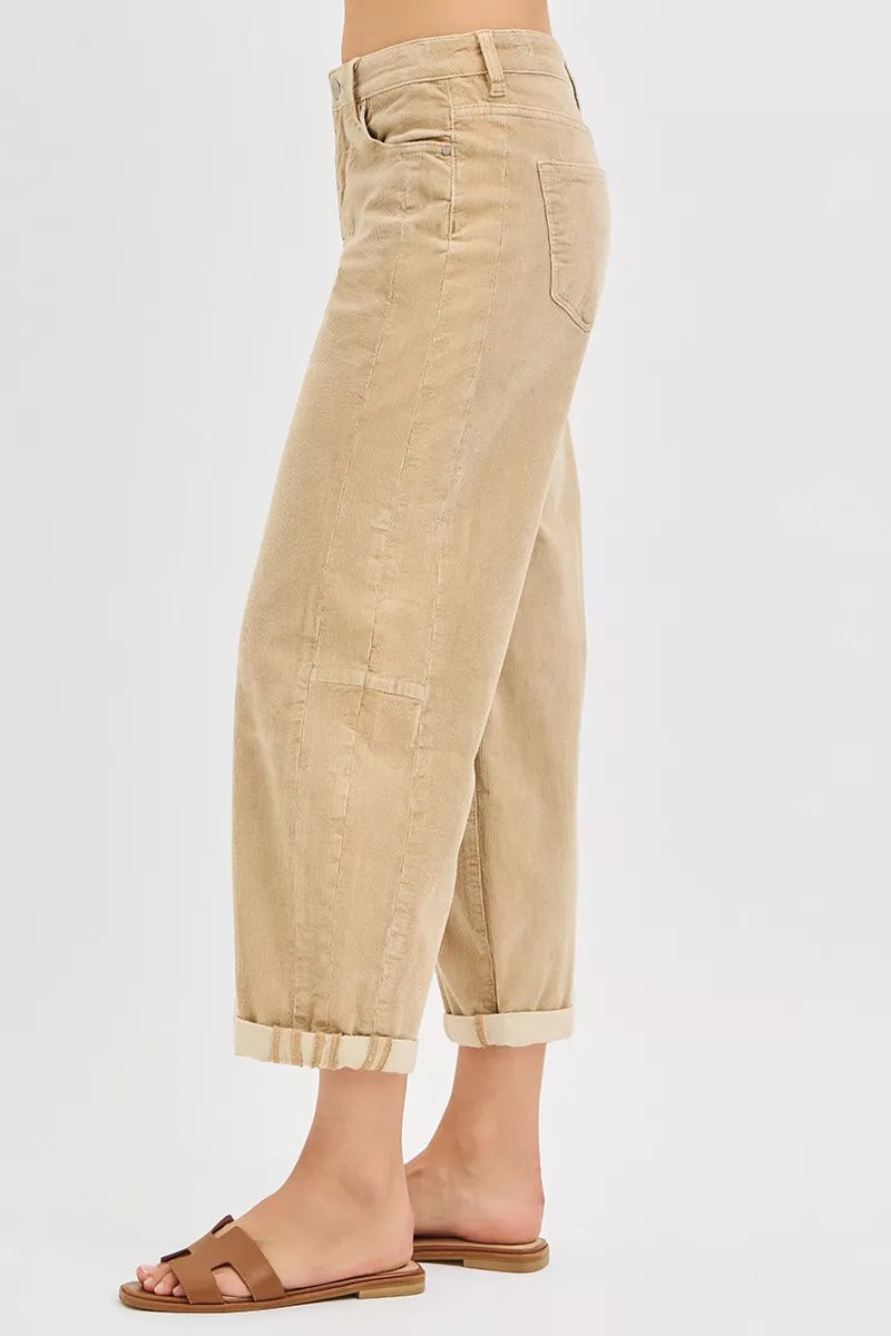 Side view of the tan cropped barrel leg pants with slide sandals