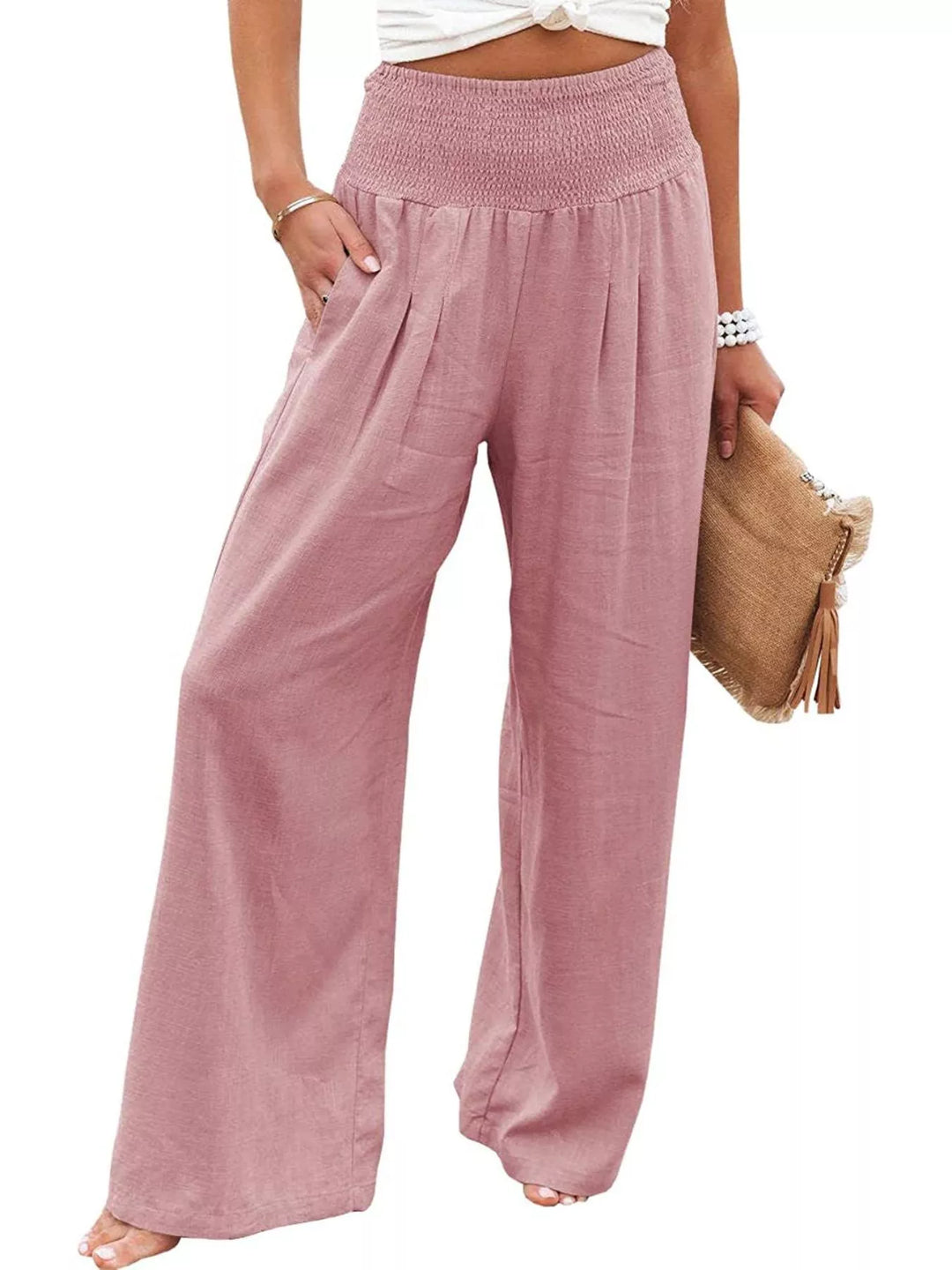 Dusty pink wide leg pants with smocked waist and pleats, front view
