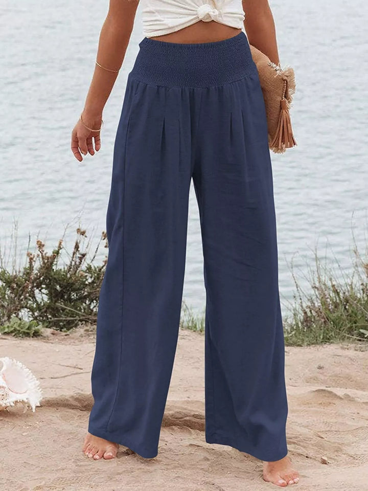 Navy high waisted wide leg pants with smocked waist, front view