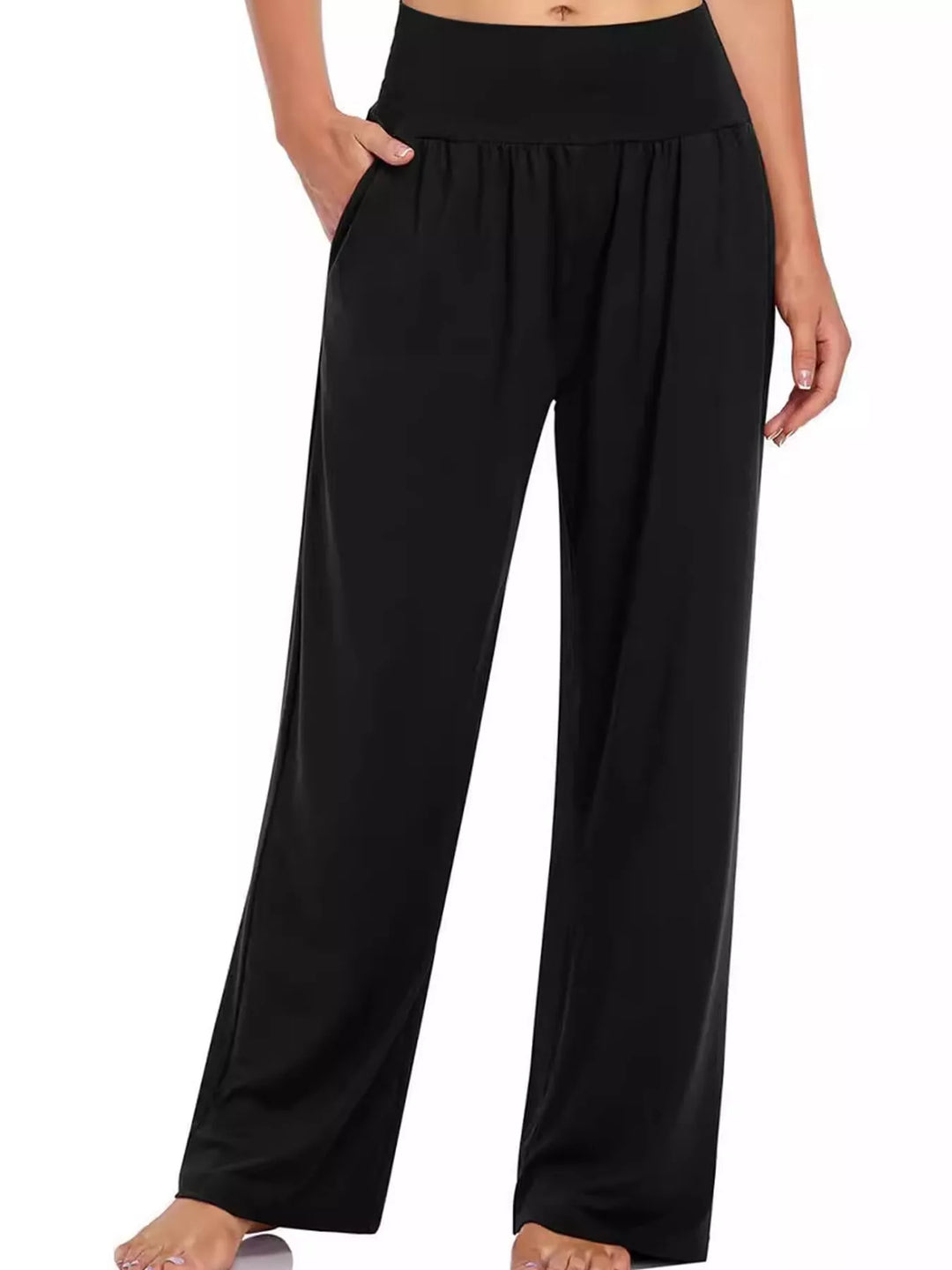 Women's black high waisted wide leg pants, front view with hand in pocket