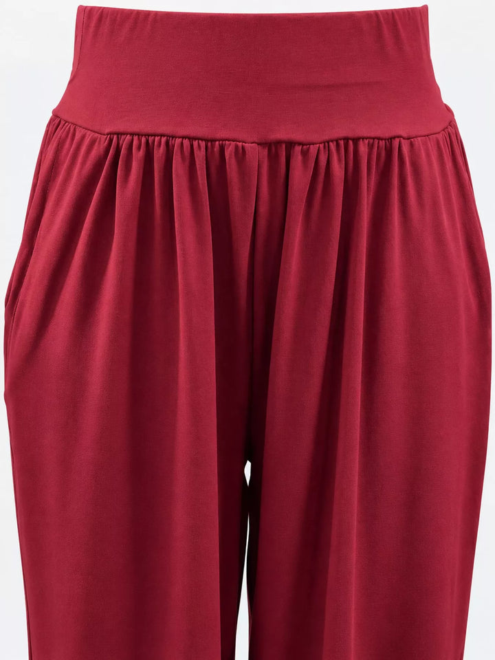 Crimson high waisted wide leg pants, close-up of the waistband and pocket