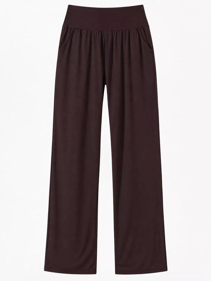Dark brown high waisted wide leg pants, laid flat showing the straight wide legs