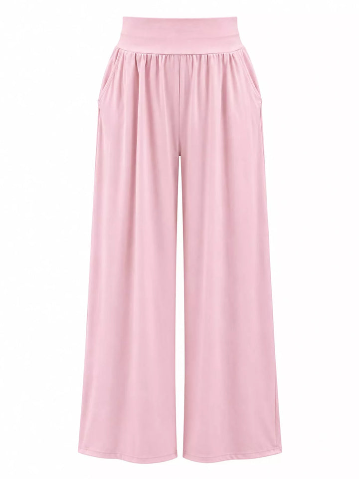 Light pink high waisted wide leg pants, laid flat showing the full length