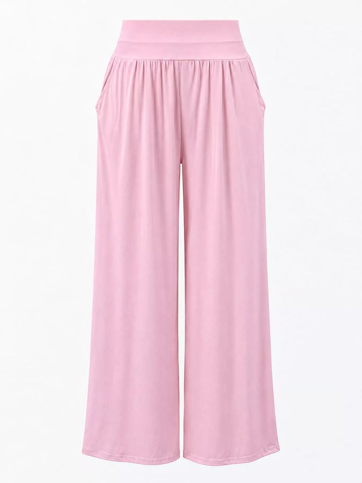 Light pink high waisted wide leg pants, flat front view with smocked waistband