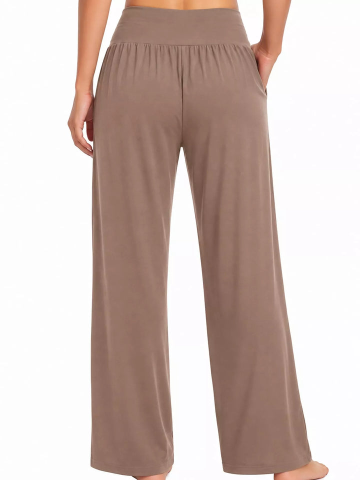 Mocha high waisted wide leg pants, front view with hands at the pockets