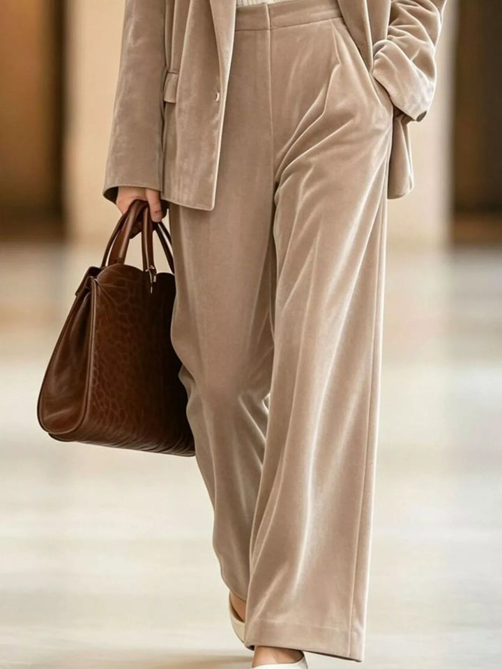 Mushroom wide leg pants and open blazer, close view with a brown tote