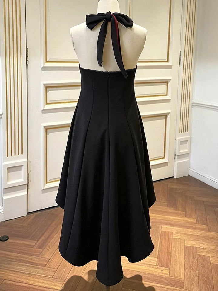 Black midi dress back view showing the halter neck with tie