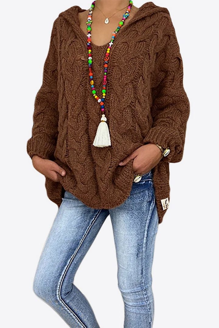 Brown oversized hooded sweater worn with light wash jeans, front view
